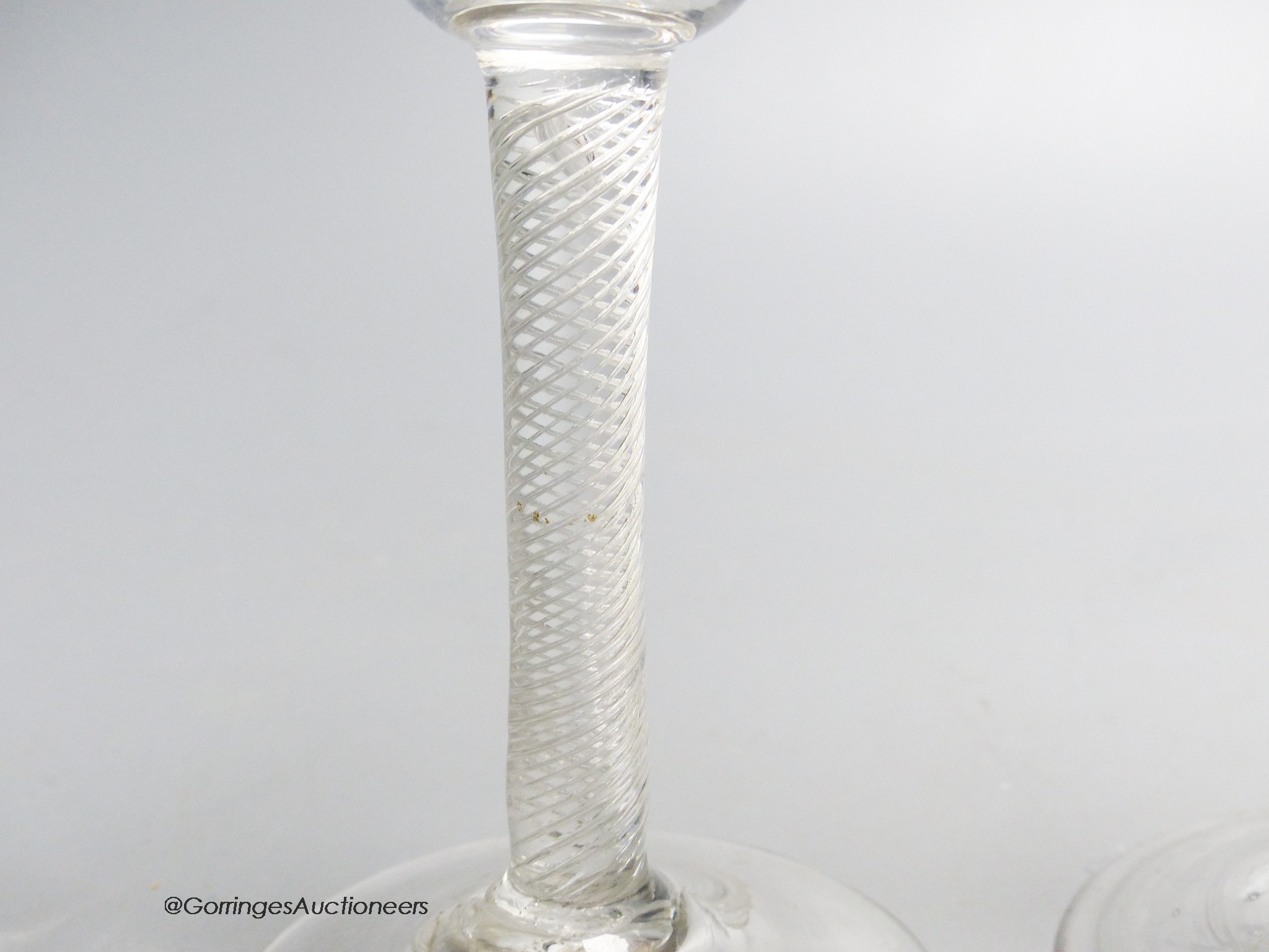 A Georgian air twist stem wine glass and an air twist stem drawn trumpet ale glass, c.1750, tallest 19cm